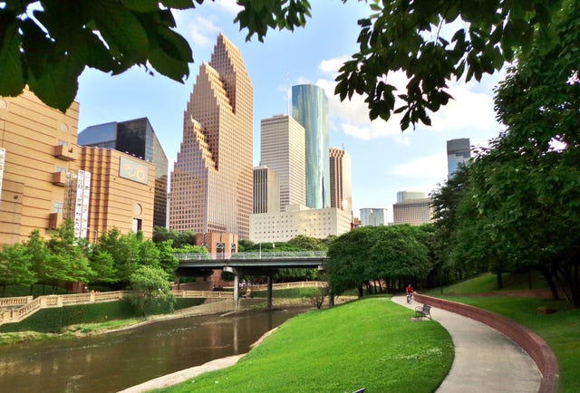 path in buffalo bayou park leading to downtown houston, texas, usa