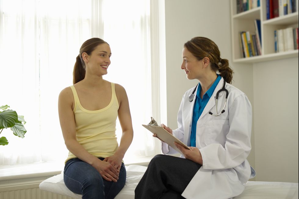 Patient talking to female doctor.