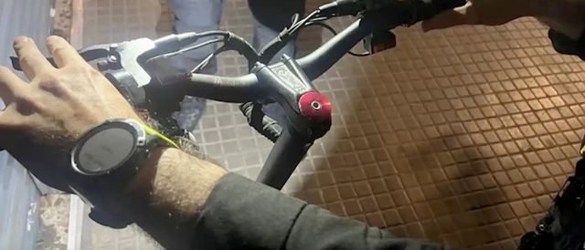 a person holding a bicycle