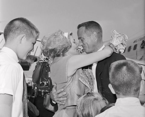 Astronaut Scott Carpenter Embracing His Wife Rene with Onlookers