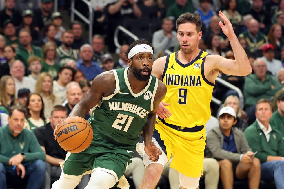 milwaukee, wisconsin april 30 patrick beverley 21 of the milwaukee bucks drives around tj mcconnell 9 of the indiana pacers during game five of the eastern conference first round playoffs at fiserv forum on april 30, 2024 in milwaukee, wisconsin the bucks defeated the pacers 115 92