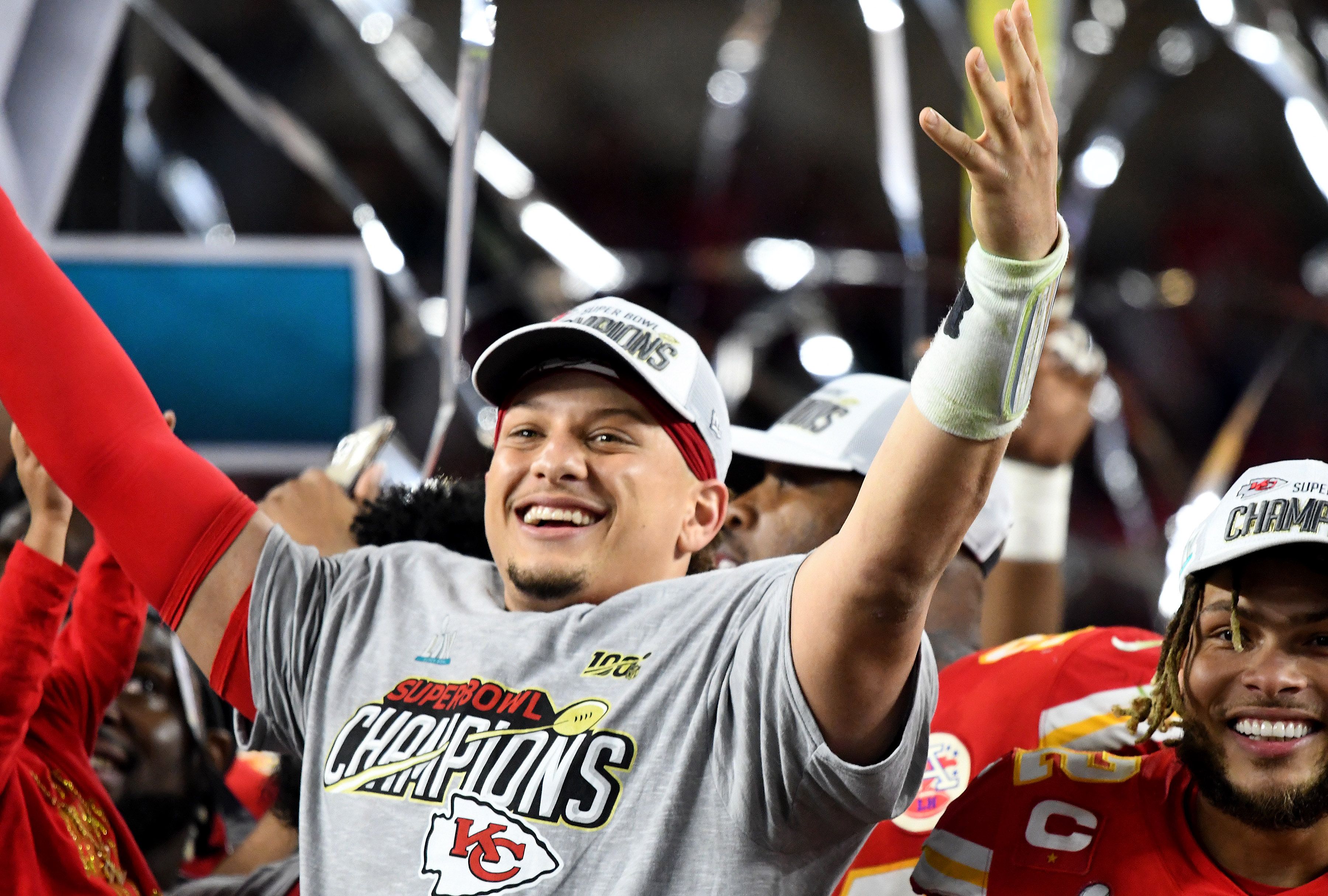 Patrick Mahomes Kansas City Chiefs Unsigned Super Bowl LVII Champions  Celebrating with the Lombardi Trophy Photograph