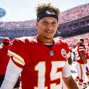 patrick mahomes in the kansas city chiefs uniform, at arrowhead stadium