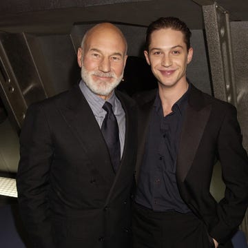 patrick stewart and tom hardy smile on the red carpet at a star trek movie premiere in 2002
