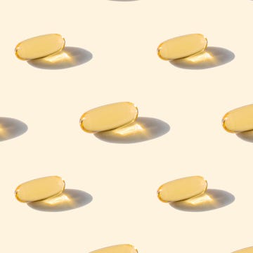 A pattern of omega capsules on a beige background a pattern of omega capsules on a beige background