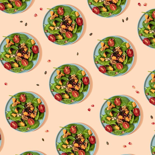 pattern of plates of fresh ready to eat vegan salad