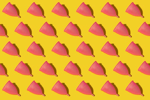 pattern of rows of pink menstrual cups