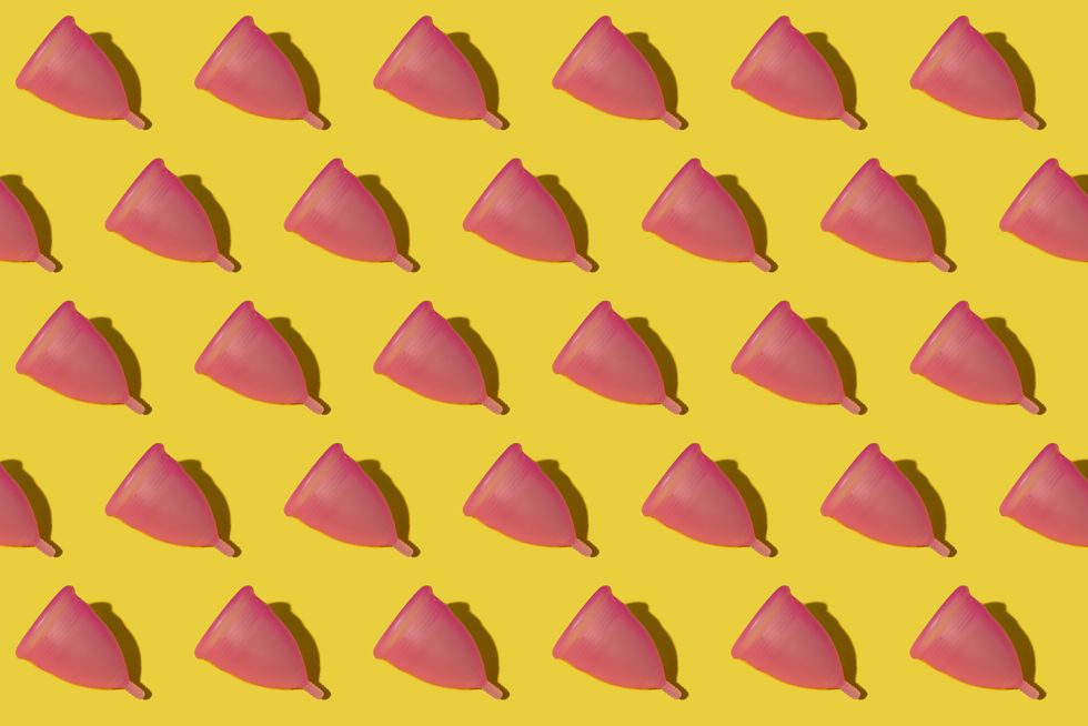 pattern of rows of pink menstrual cups