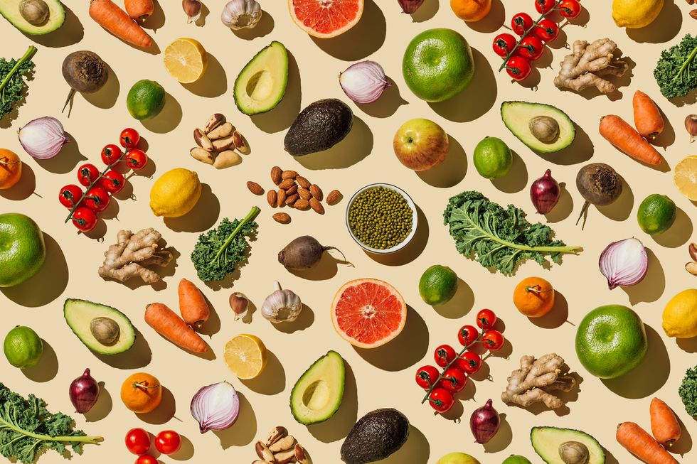 pattern of variety fresh of organic fruits and vegetables and healthy vegan meal ingredients on beige background healthy food, clean eating, diet and detox, eco friendly, no plastic concept  flat lay, top view