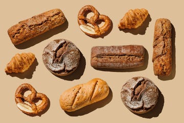 pattern of various bakery products handmade on beige background creative layout with bread, buns, croissant, bread loaves and pretzels modern minimal food photography collage in pop art style flat lay, top view