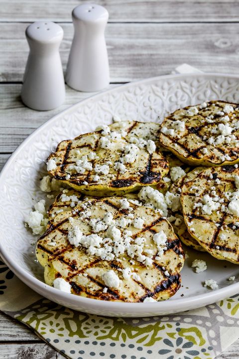 grilled patty pan squash topped with seasonings and crumbled goat cheese