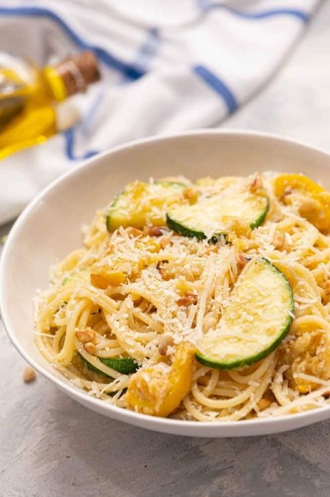summer squash lemon spaghetti in a bowl with parmesan cheese on top