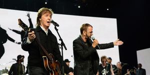 paul mccartney playing a guitar and ringo starr singing