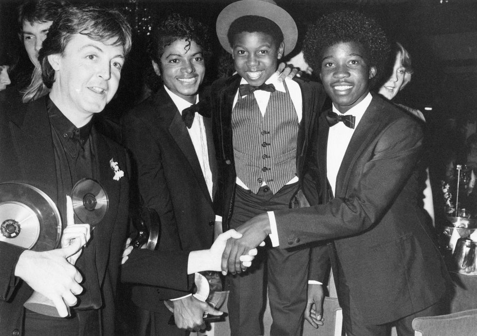 Paul McCartney poses with Michael Jackson, Michael Grant and Junior Waite of Musical Youth at the British Record Industry Awards in February 1983.