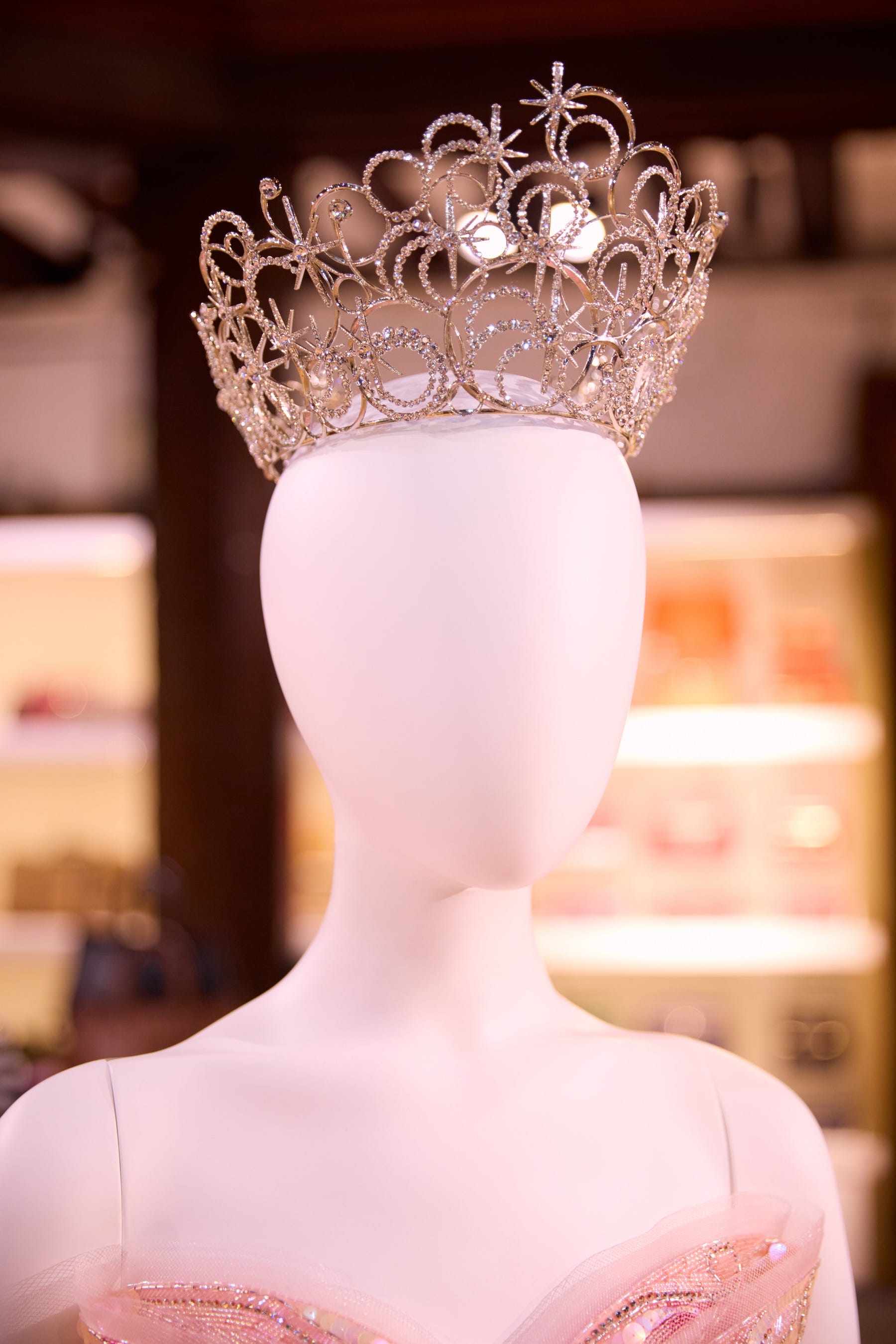 a decorative crown displayed on a mannequin