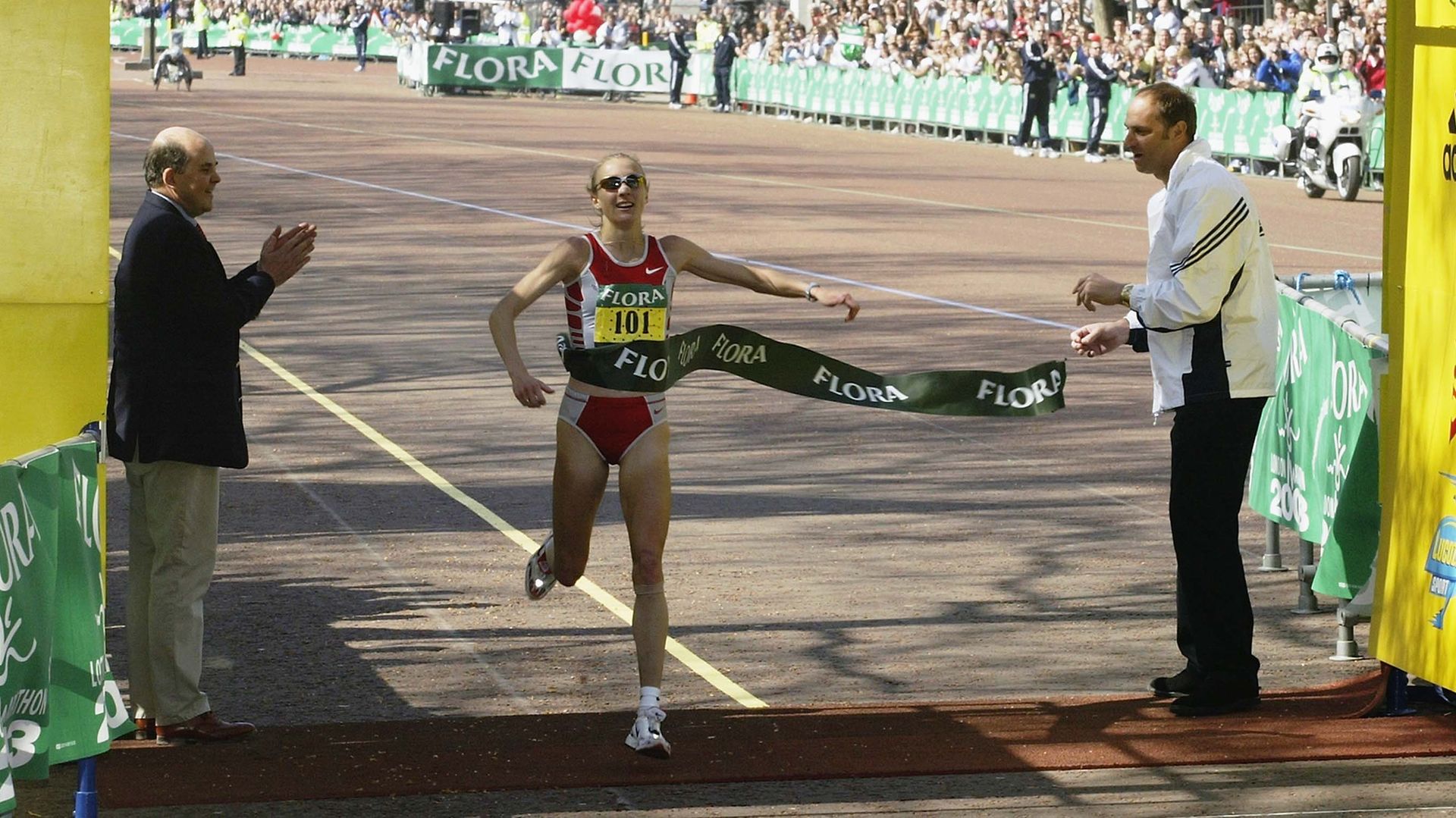 Paula Radcliffe of Great Britain crosses the line to win