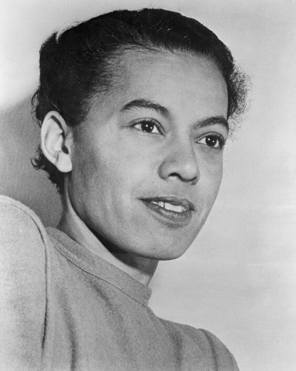 pauli murray looks to the right and weras a shirt
