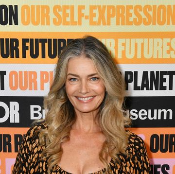 paulina porizkova wears brown and black spotted dress smiling at meteor meet the moment summit
