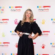 paulina porizkova posing on the red carpet at ernsting's family fashion show 2022
