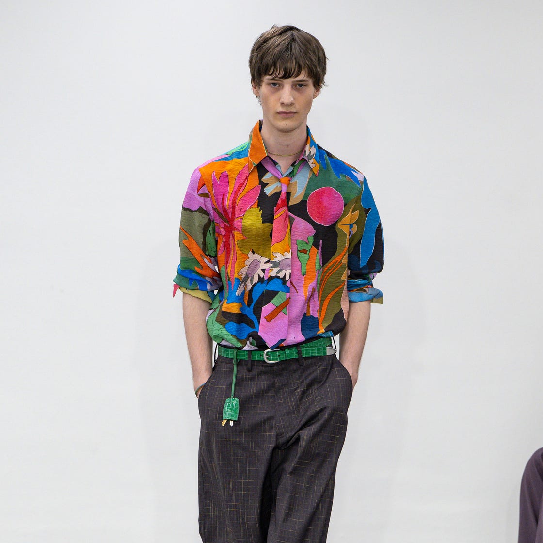 fashion model showcasing a vibrant outfit on the runway fashion model showcasing a vibrant outfit on the runway