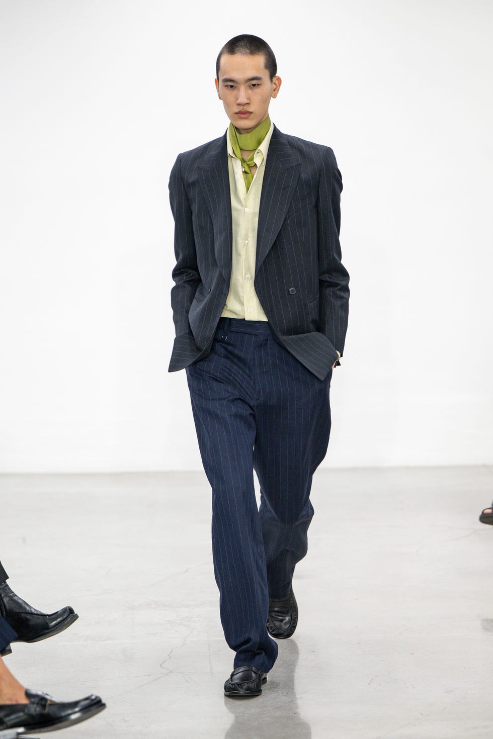 fashion model showcasing a modern outfit on a runway
