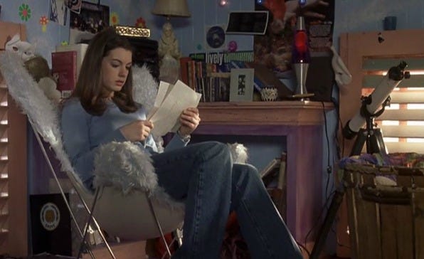 movie interior design person sitting in a cozy chair reading letters