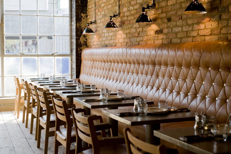 Brick, Wall, Furniture, Chair, Architecture, Table, Interior design, Room, Building, Restaurant, 