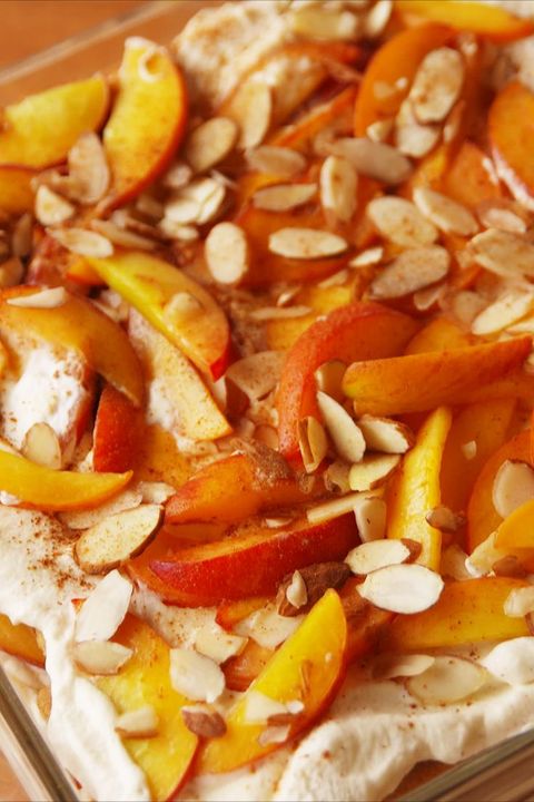 closeup of peaches and cream lasagna topped with sliced almonds