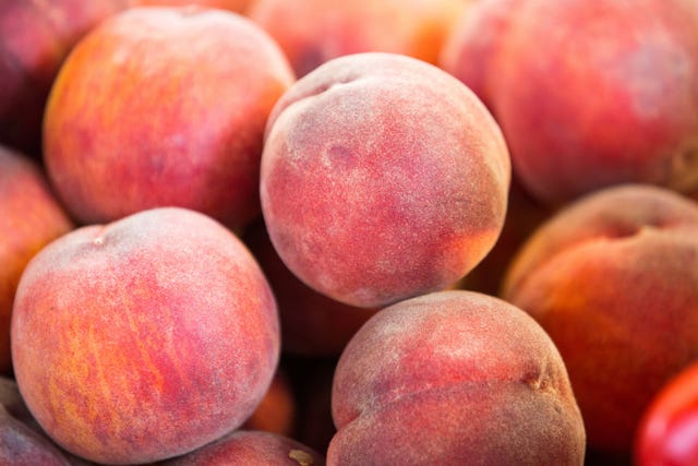 peaches seen displayed on the shelves of wroclaw market hall