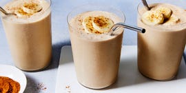 peanut butter banana smoothie with banana slices and cinnamon on top