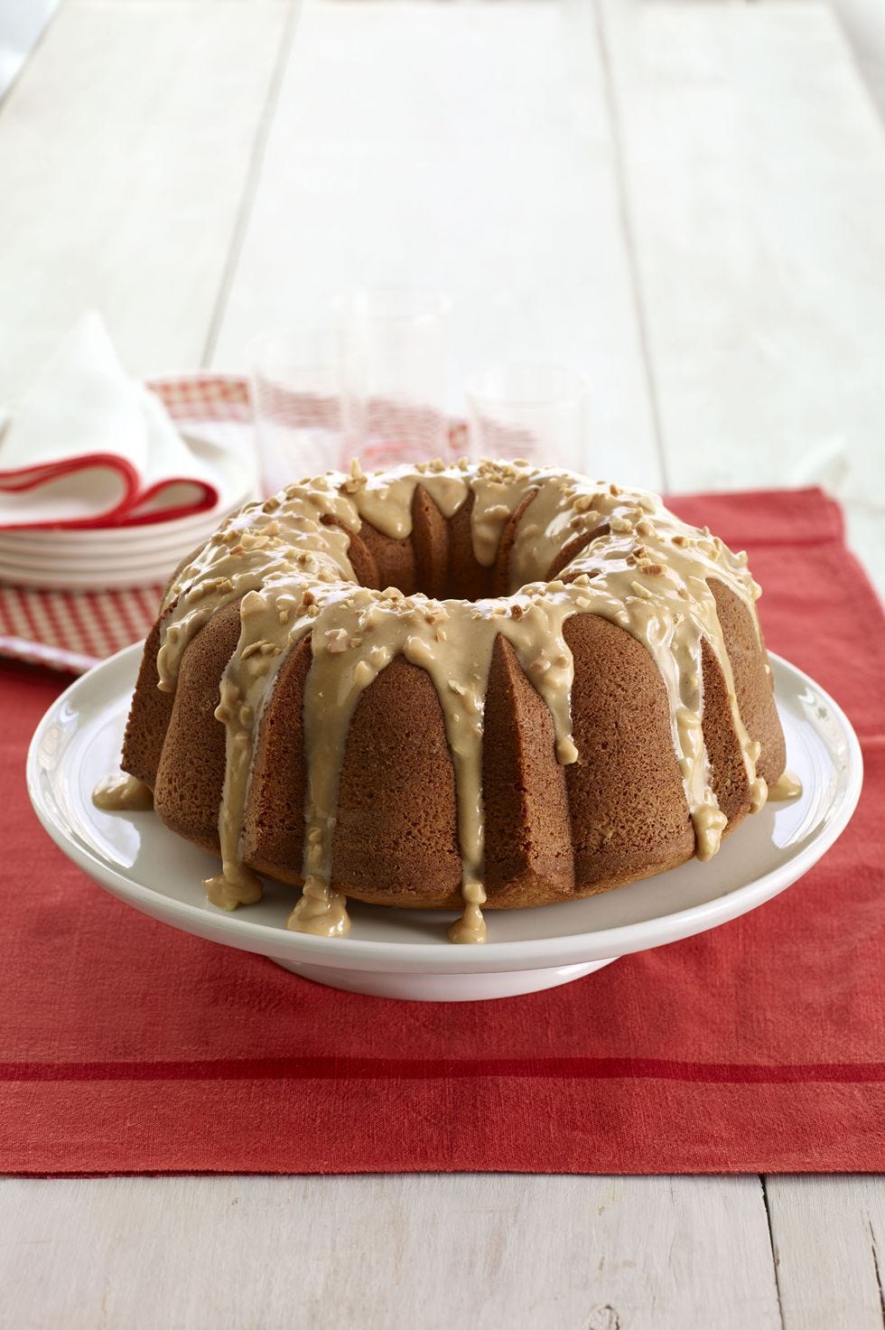 peanut butter bundt cake on a white cake stand