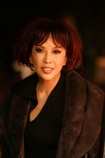 a headshot of a woman with a bob