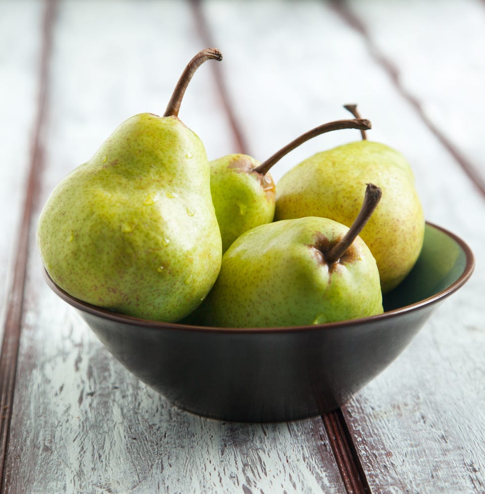 fresh ripe pears in bowl