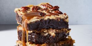 brownies with a pecan pie topping and caramel drizzle