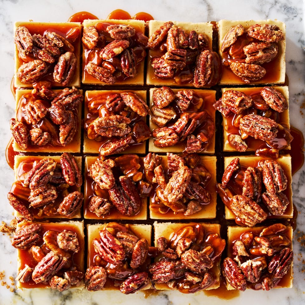 cheesecake bars topped with a pecan pie topping