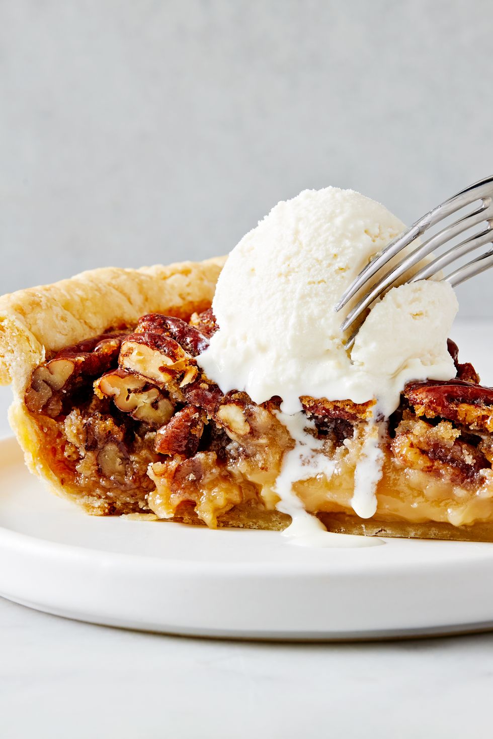 pecan pie with crunchy pecans and a flaky crust