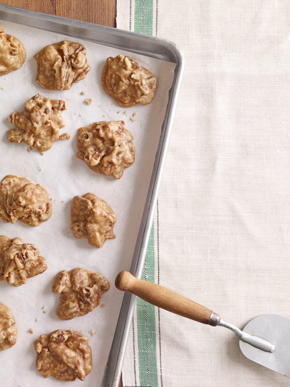 pecan pralines cookie batter on a baking sheet lined with parchment paper