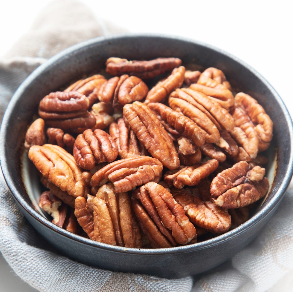 pecans in a shallow bowl pecans in a shallow bowl