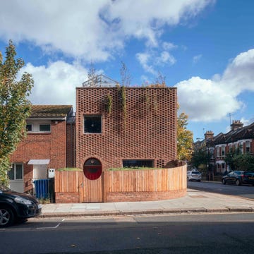 a brick house with a roof terrace