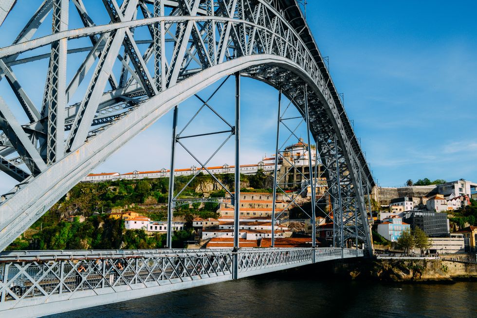 Pedestrians on the Dom Luis I Bridge, a metal arch bridge that spans the Douro River between the cities of Porto and Vila Nova de Gaia, Portugal