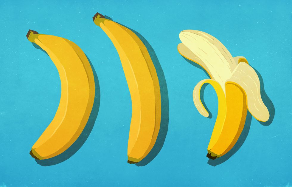 peeled and unpeeled bananas on blue background