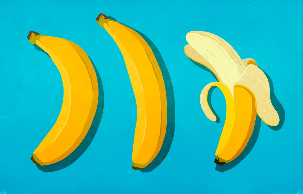 peeled and unpeeled bananas on blue background