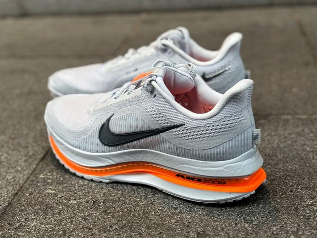 running shoes with a sleek design and prominent brand logo