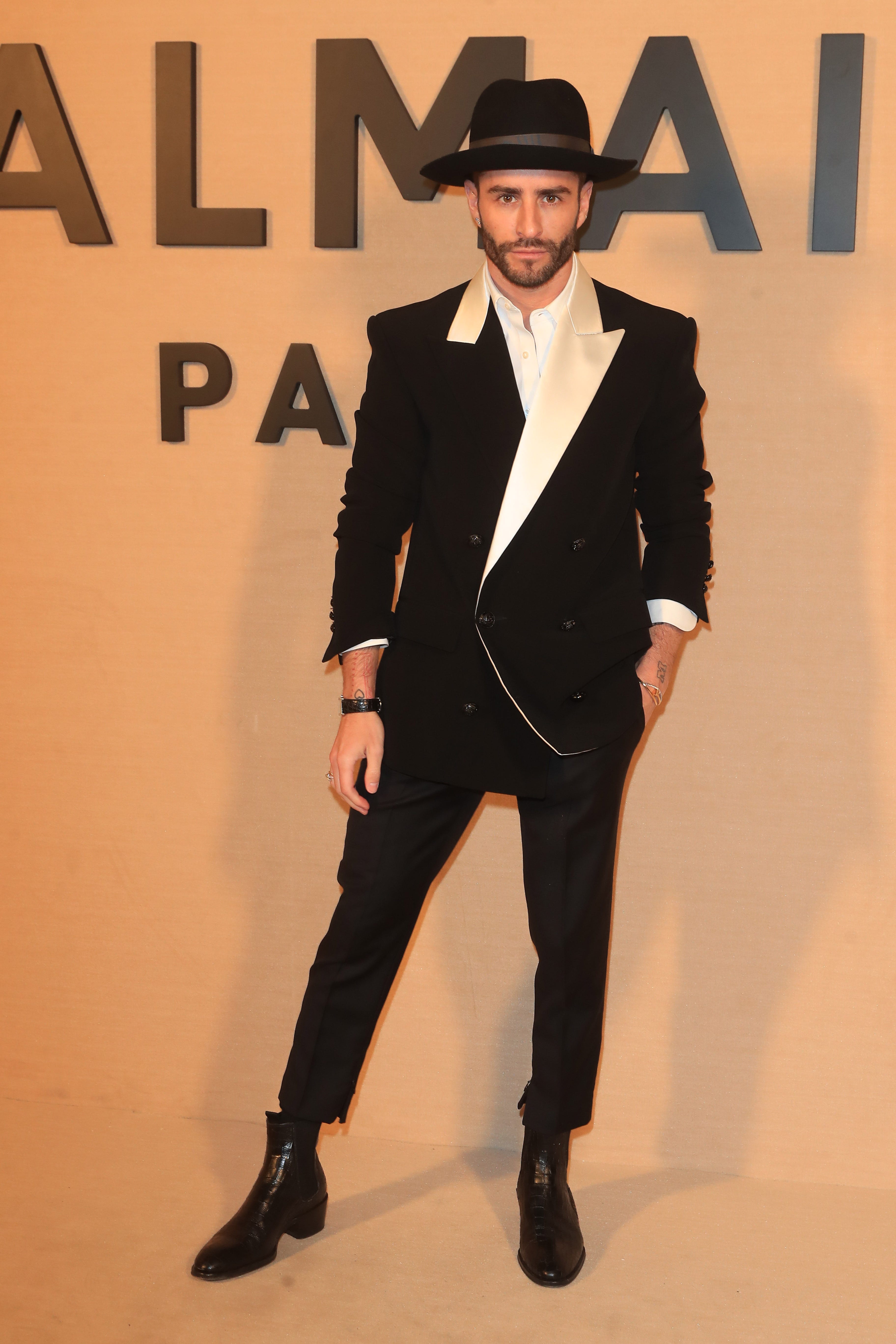 Suit, Formal wear, Clothing, Tuxedo, Fashion, Fedora, Blazer, Outerwear, Headgear, Bowler hat, 
