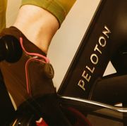 molly ritterbeck photographed in her apartment  in nyc in december 2020 riding her peloton bike