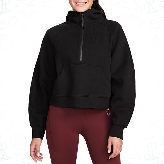 woman wearing a black half zip hoodie