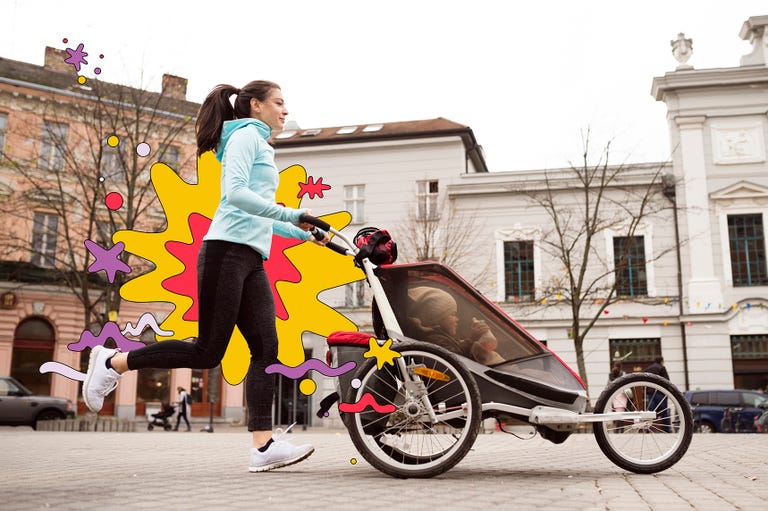 woman running pushing baby in a jogging stroller