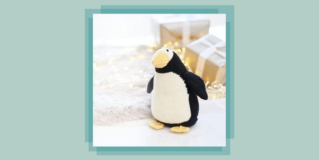 a knitted penguin on a table