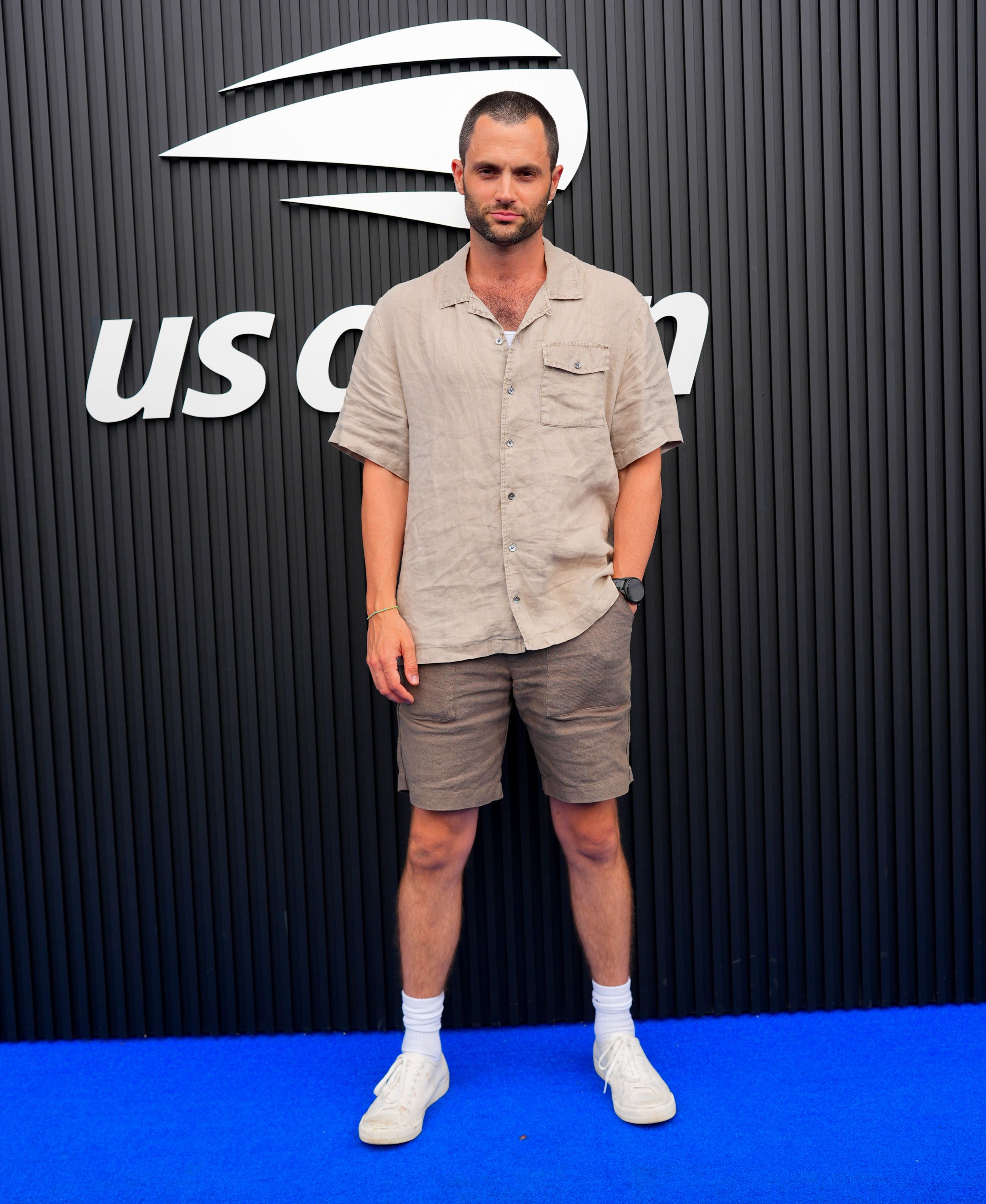 You's Penn Badgley debuts shaved head transformation