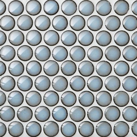 round blue tile with brown outline